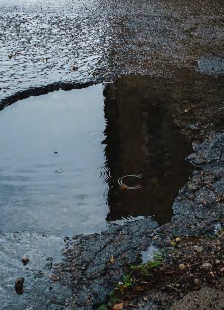 large pothole filled with water