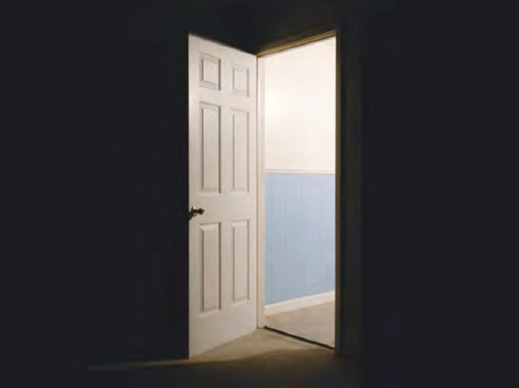 open door to a bright hallway