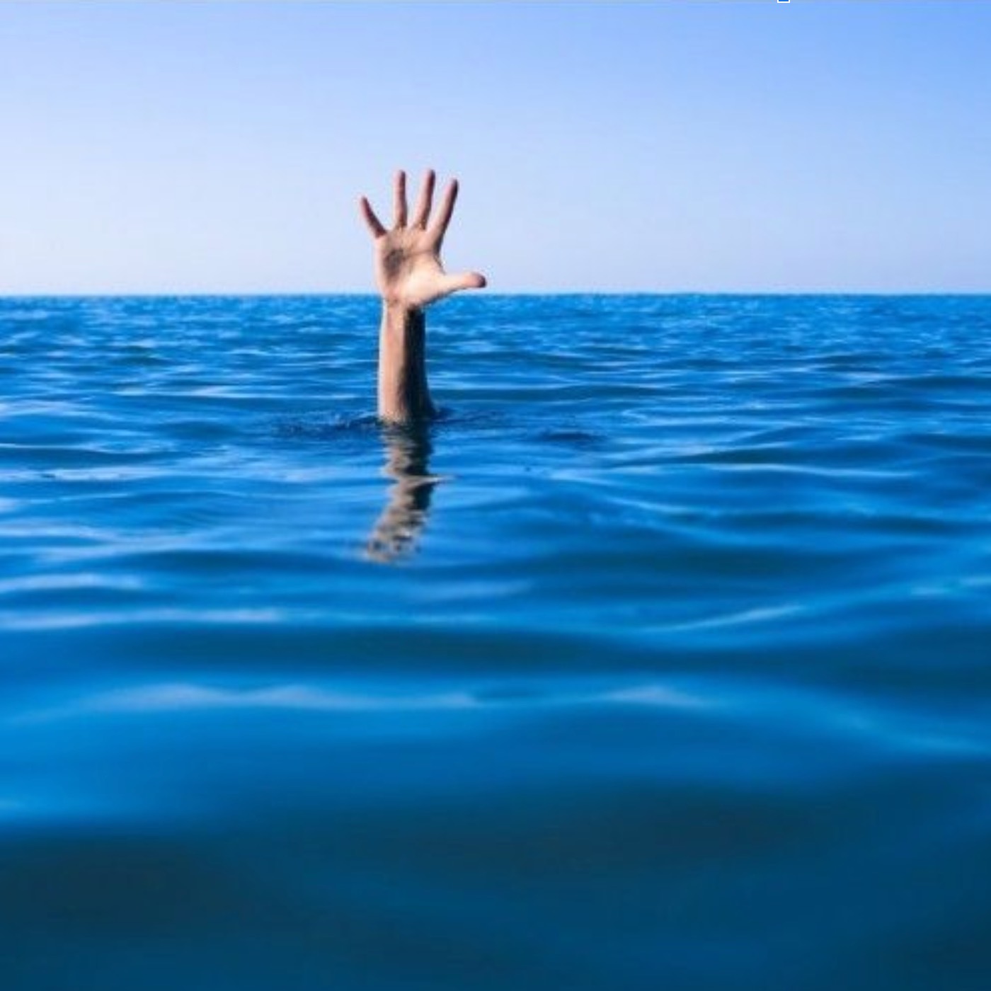 person drowning raising hand