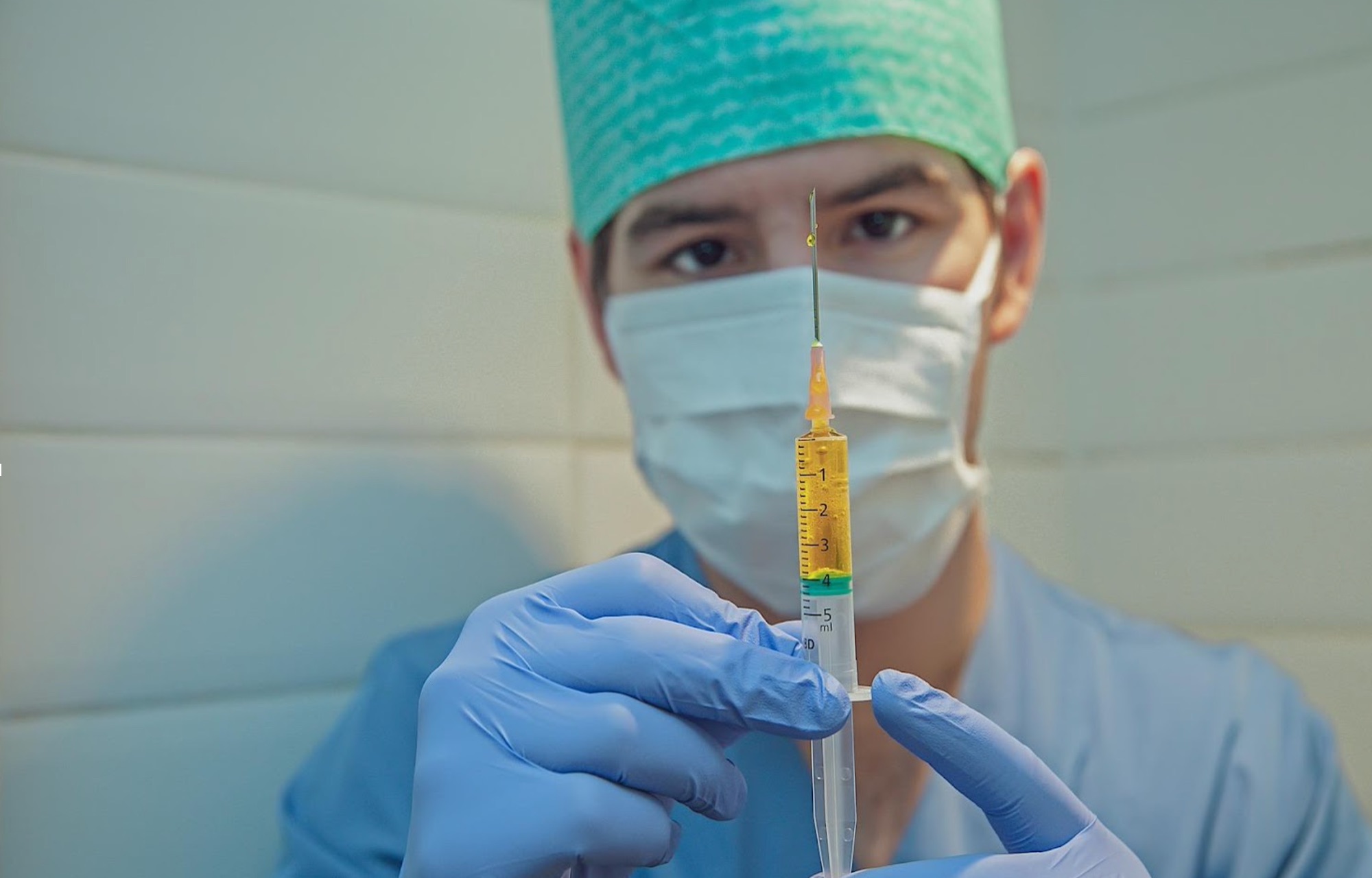 medical professional with syringe