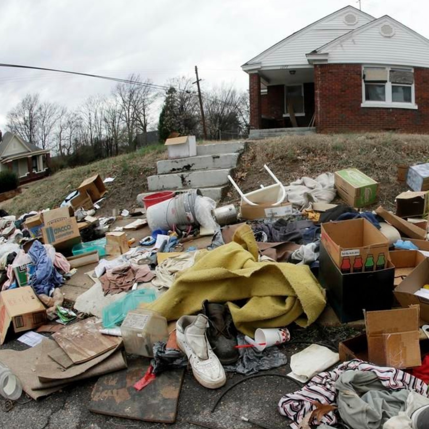 junk piled up outside house