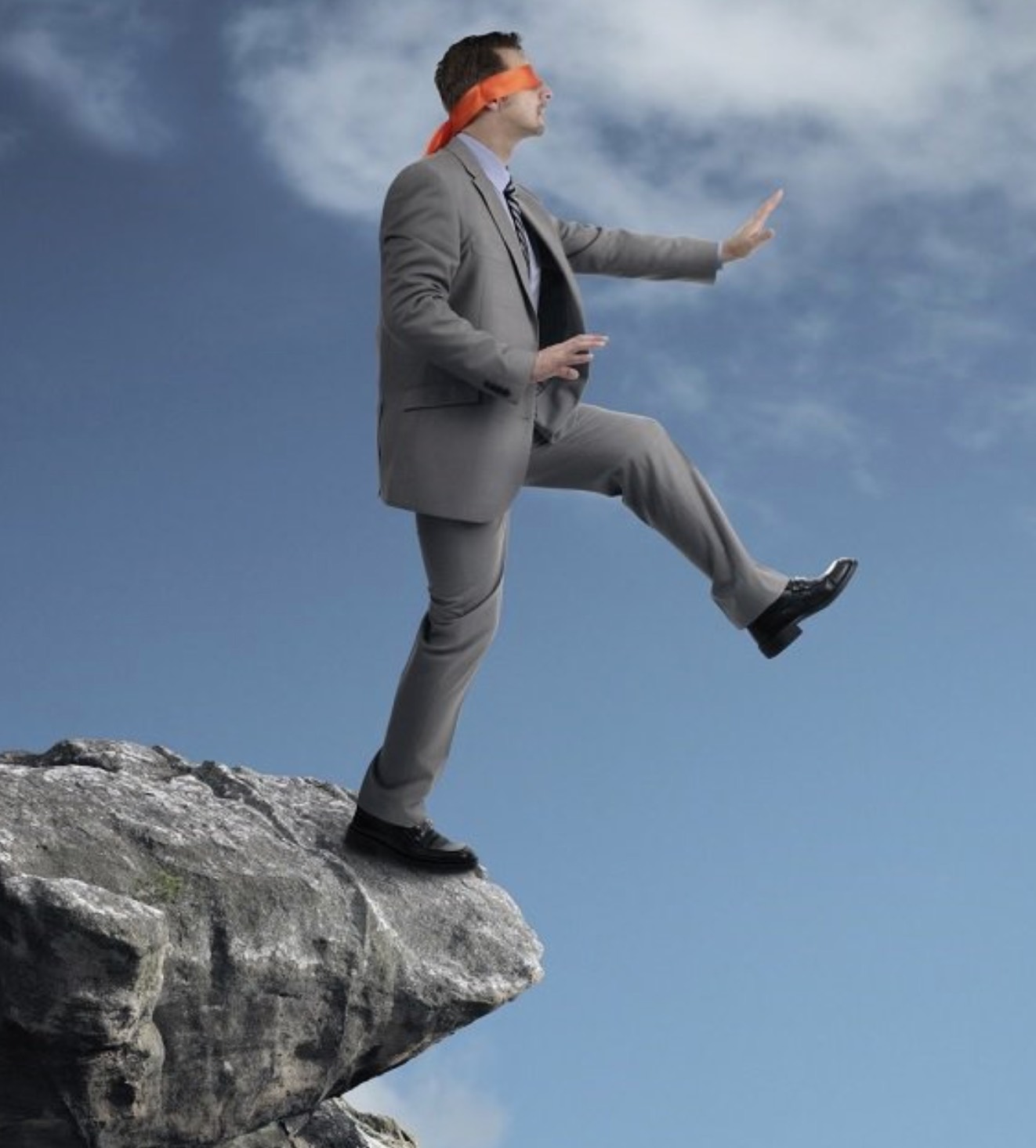 blindfolded person walking off a cliff